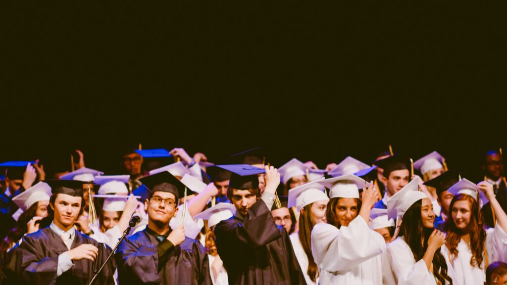 Students in caps and gowns at graduation