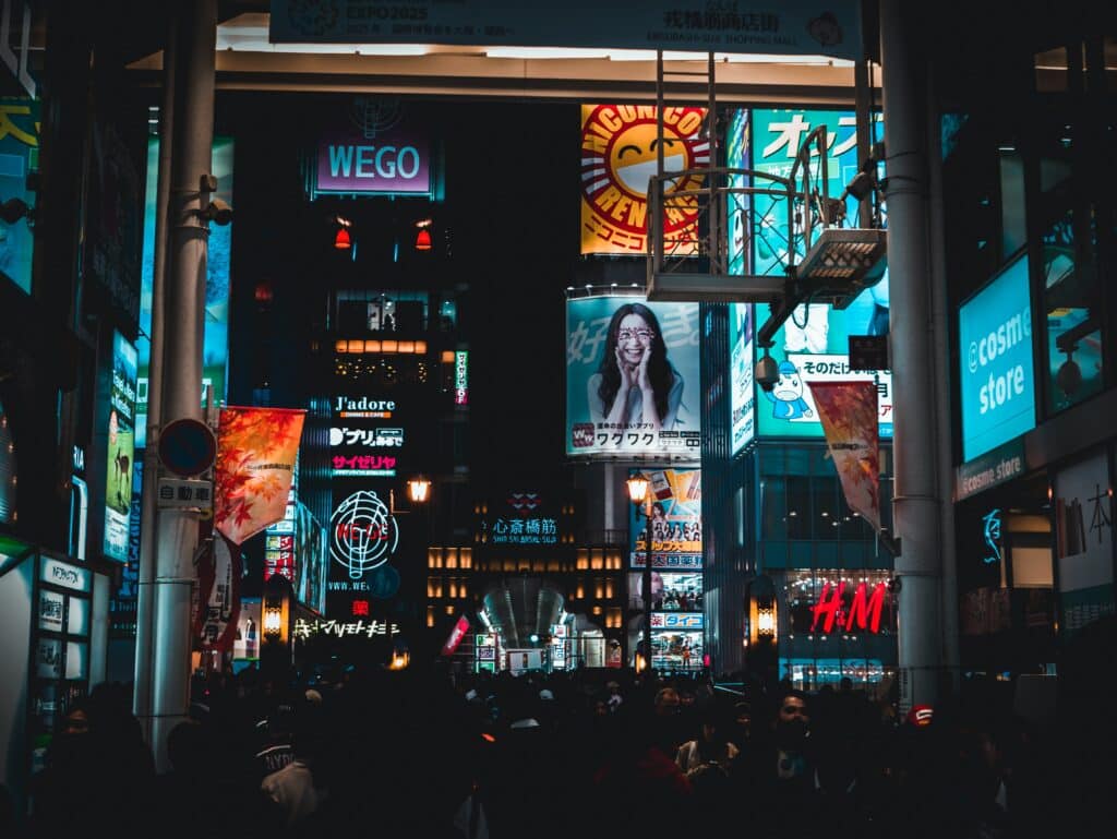 Nighttime in a large city with electronic billboards