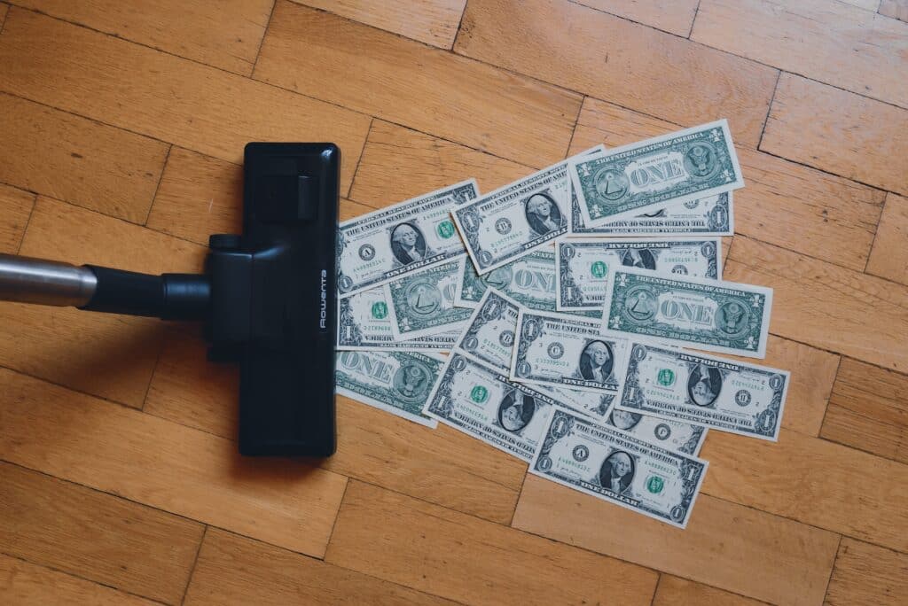 Vacuum going over a bunch of dollar bills