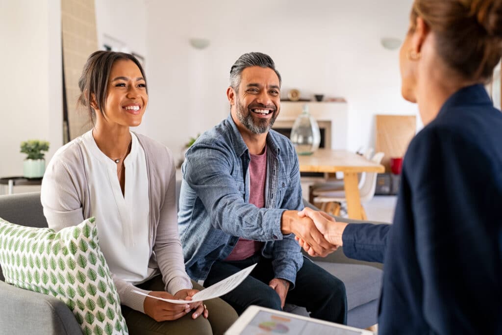 A couple meets with an insurance agent