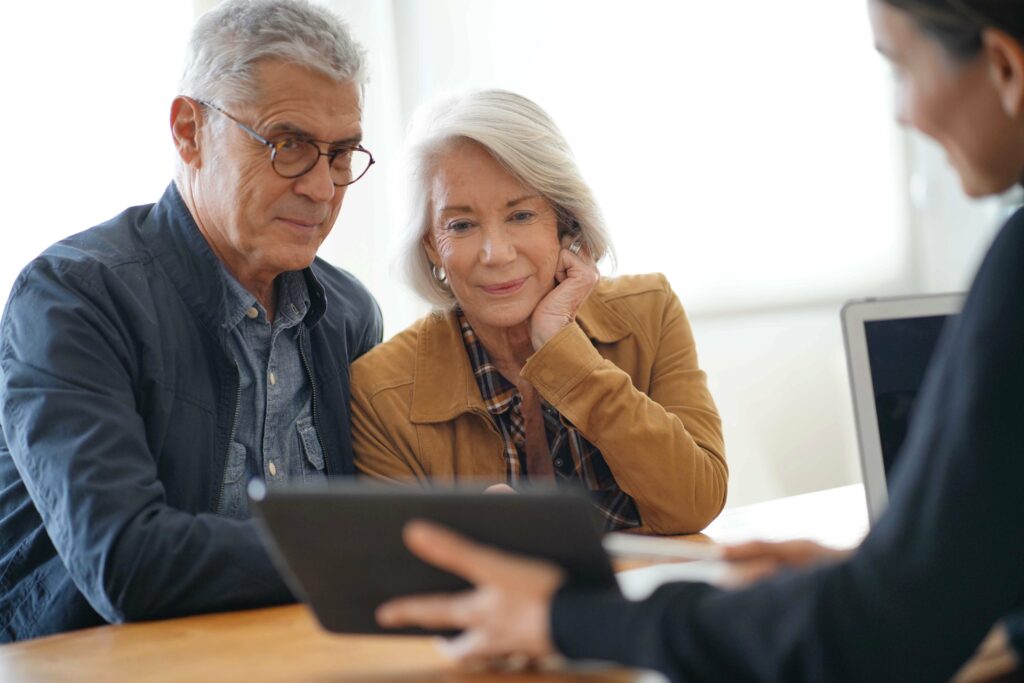 And elderly couple meet with a banker.