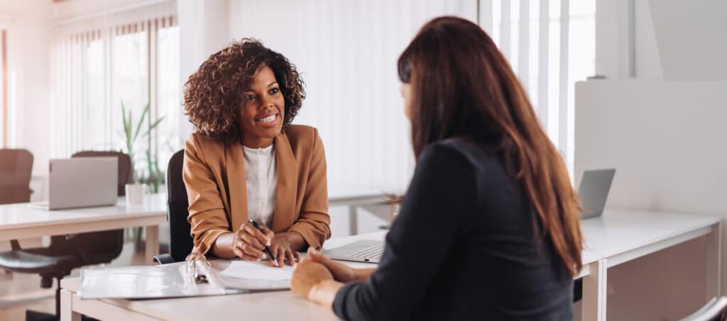 A woman talks with a banker