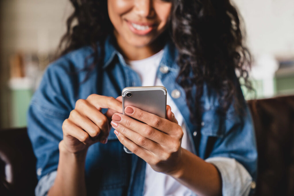 A woman uses her smartphone.