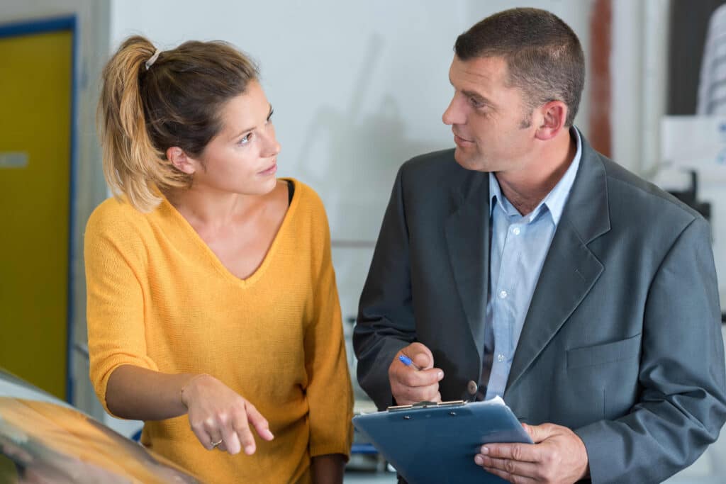 A woman meeting with an insurance agent